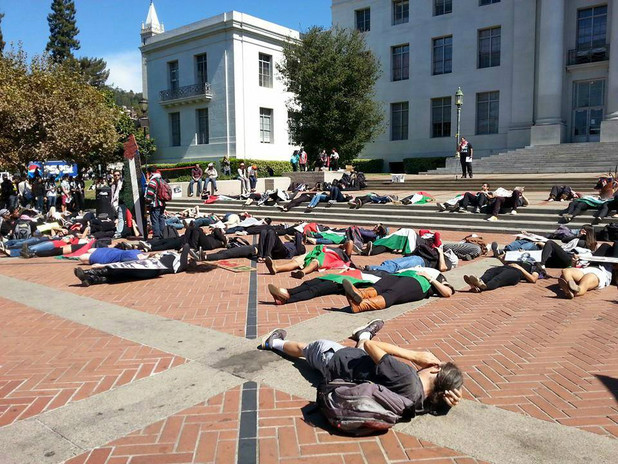 Students at the University of California, Berkeley engage in a “die-in” protest on the steps of Sproul Hall on 23 September