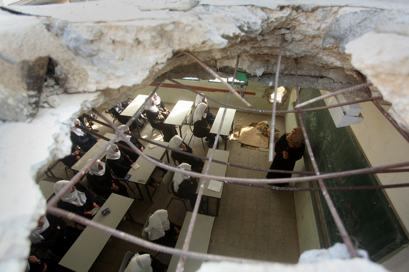 A classroom at the Martyrs School in Khuzaa, which was damaged by Israeli shelling in the summer of 2014, as well as in previous assaults on Gaza, photographed in August 2015. (Ashraf Amra / APA image)s